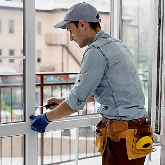 a-man-straightens-a-plastic-window-or-door-with-a-2022-11-12-09-54-34-utc-3x
